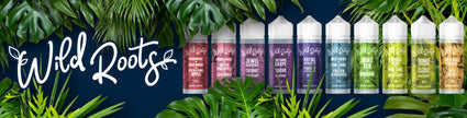 Wild Roots e-liquid bottles in various colors with lush green leaves on a dark background.