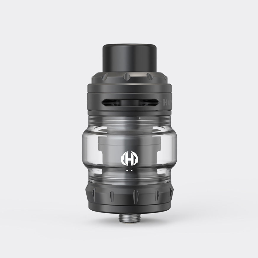 Industrial vaping tank with transparent glass and black metal design, showcasing airflow slots and top-fill mechanism.