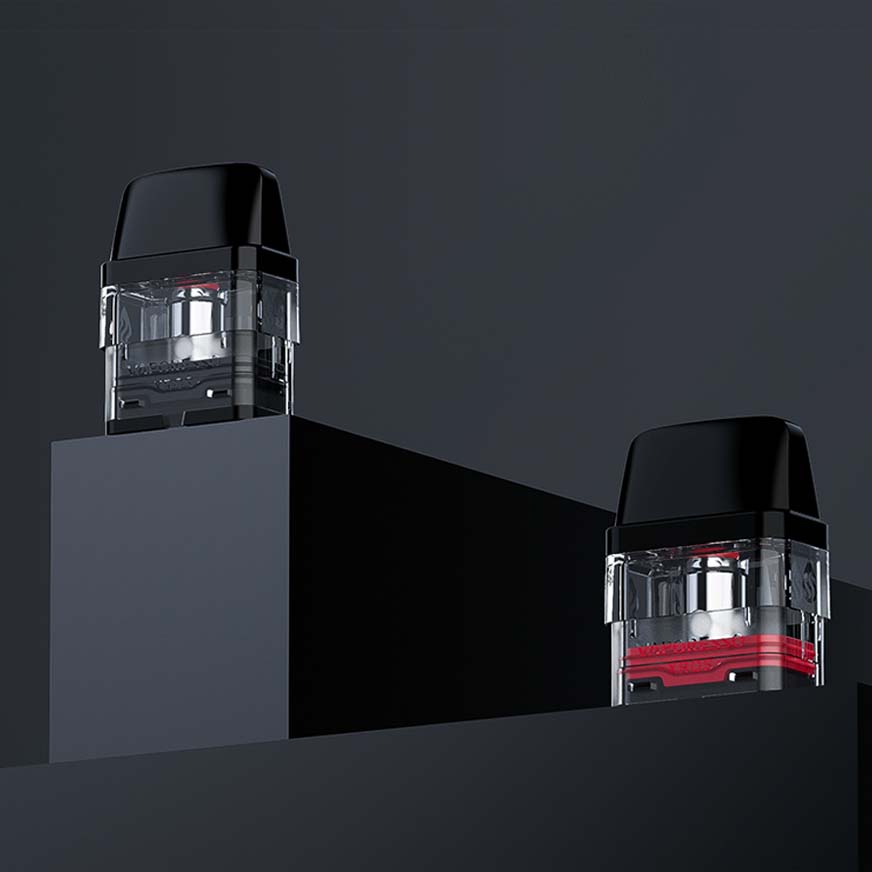 Two black and transparent vape pods on a dark, minimalist platform, showcasing modern vaping technology and design.