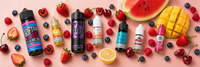 Assortment of fresh fruit arranged on a pastel background along with five nic salts an two shortfill bottles.