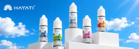 Hayati Nic Salts including summer dream, blue razz lemonade and more, are arranged on a white podium with a blue sky backdrop along with the Hayati logo. 