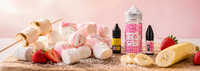 Marshmallow e-liquid bottles arranged with fluffy white marshmallows, fresh strawberries, banana slices and toasted treats.